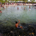 boy shows off caught fish at Puuhonua o Honaunau