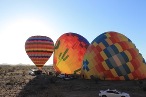 Balloons inflating in the desert